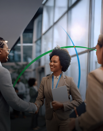 banner showing two professionals shaking hands while standing in a modern workspace