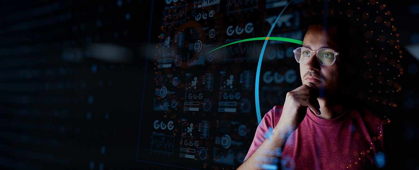 banner showing a man deep in thought while he looks at multiple analytics dashboards  