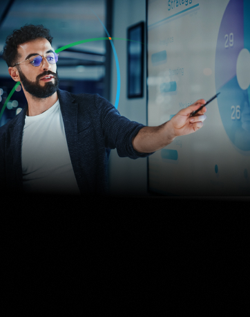 banner showing a man pointing to a large display while delivering a presentation