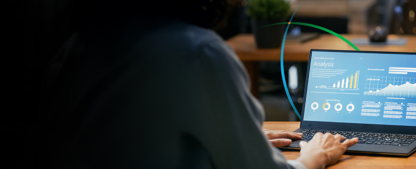 banner showing a person using a laptop to interact with analytics dashboards