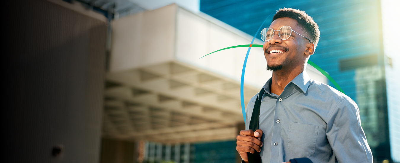 banner showing a young professional smiling while walking through a modern corporate campus