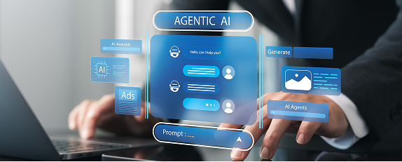 a business professional using a laptop and a tablet to interact with agentic AI
