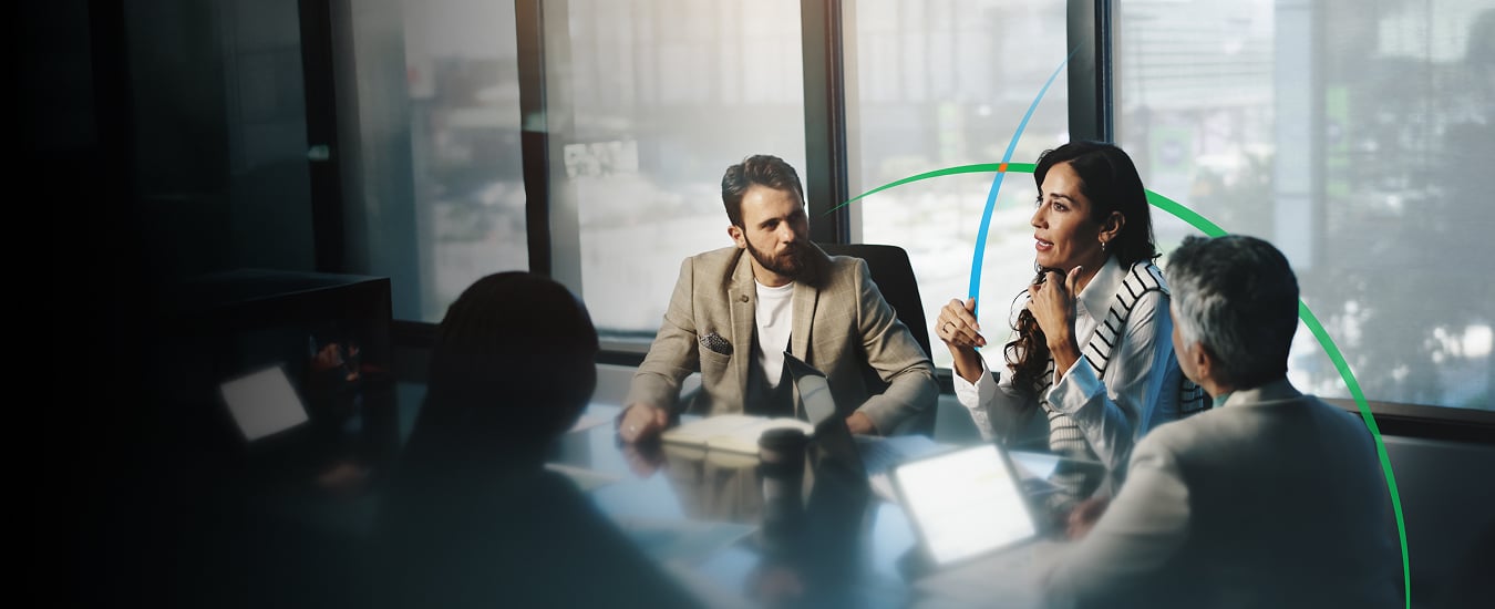 banner showing business executives having a discussion in a conference room