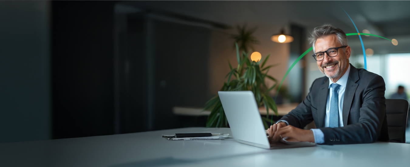 banner showing a smiling business professional using a laptop
