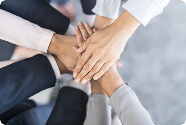 employees forming a handstack