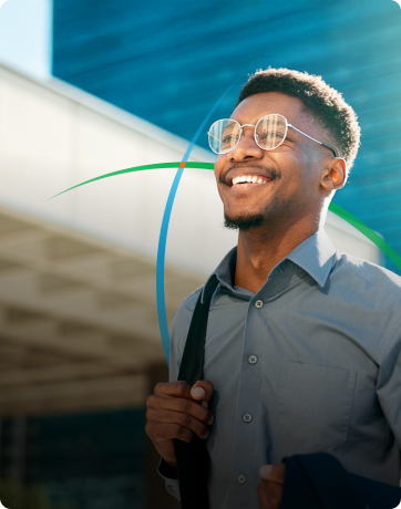 banner showing a young professional smiling while walking through a modern corporate campus