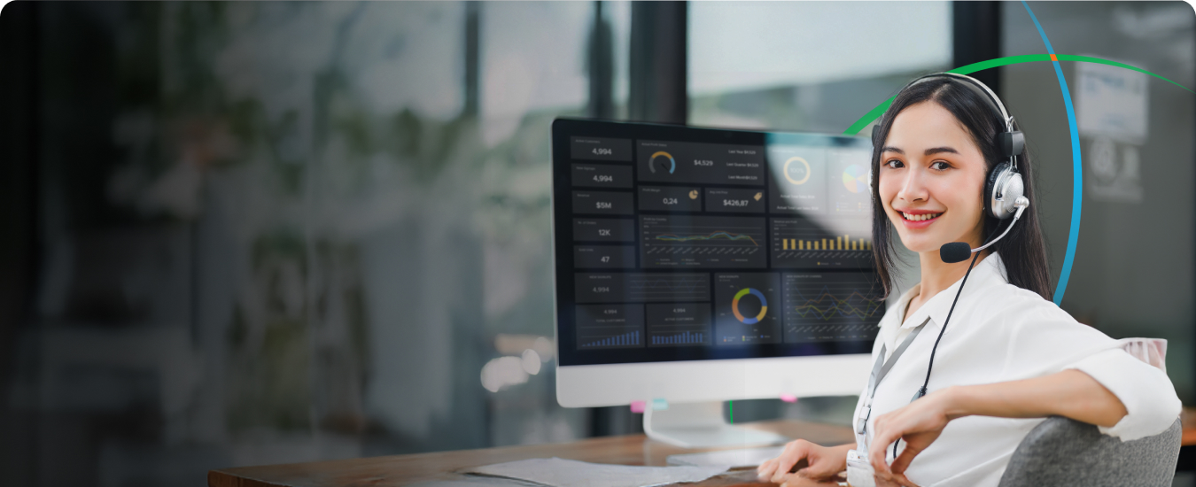 banner showing a woman sitting in front of a computer screen displaying analytics dashboards