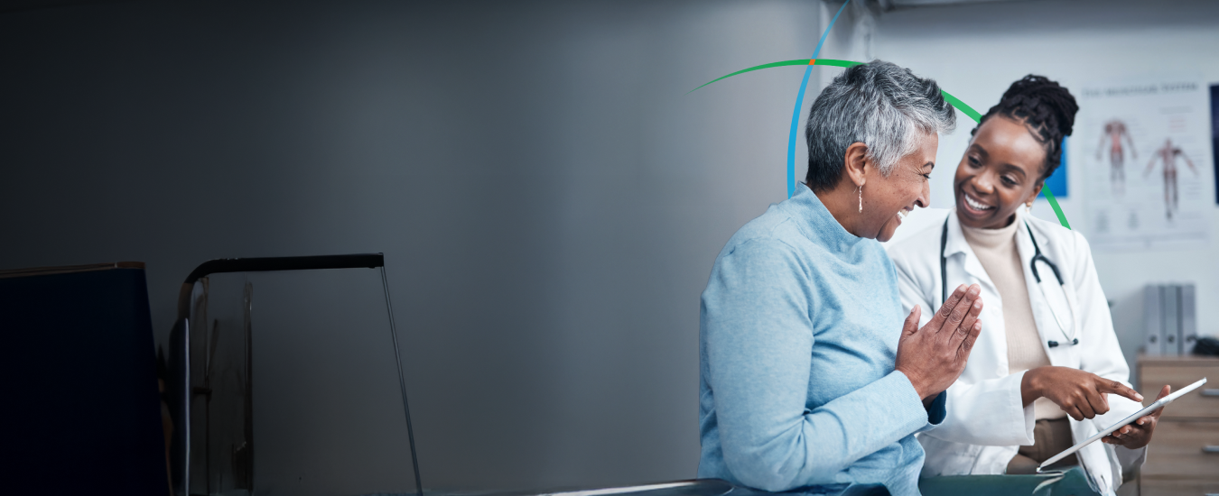 banner showing a healthcare professional and a patient smiling while looking at a tablet screen