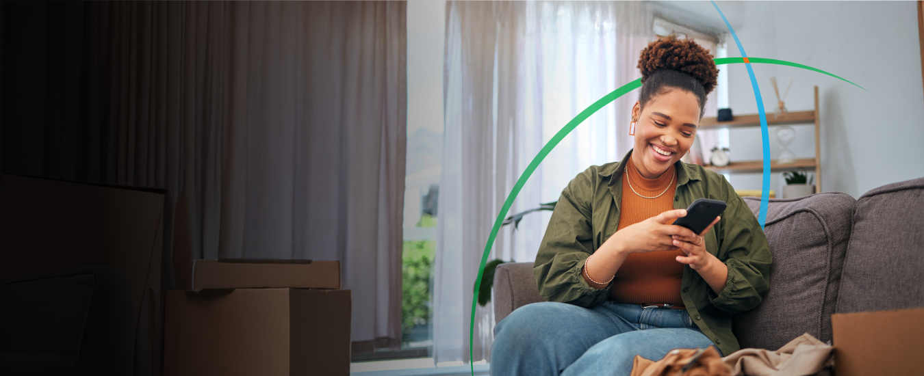 banner showing a smiling woman looking at her phone while sitting on a couch